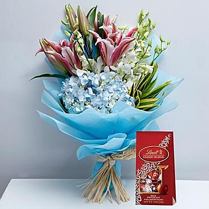 Delicate Flowers and Lindt Chocolate Combo: Flowers and Chocolate Delivery