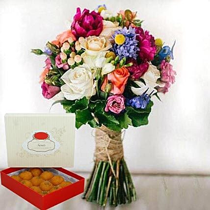 Mesmerizing Flowers and Motichoor Laddoo Combo:  Sweets Delivery