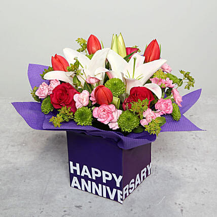Tulips Roses and Carnations in Glass Vase: Wedding Anniversary Flowers