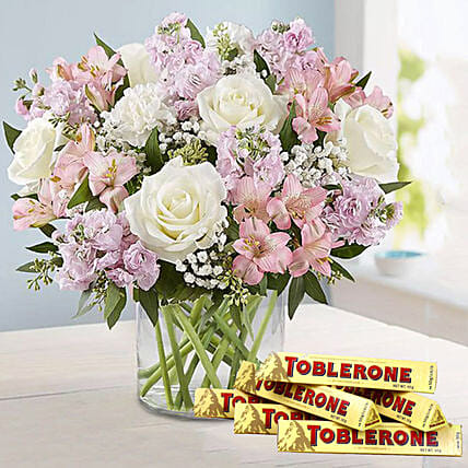 Pink N White Flowers in Vase and Toblerone Chocolates: 