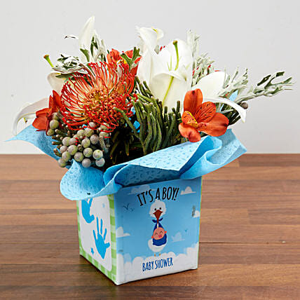 Vase Arrangement Of Oriental Lilies And Cordifolium: Newborn Baby Gift Ideas
