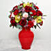 Mixed Flowers In Red Glass Vase