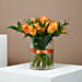 Orange Roses In Glass Vase