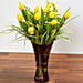 Bright Yellow Tulips In Maroon Vase