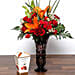 Roses and Asiatic Lilies In Vase With Chocolates