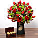 Red Tulips and Roses In Vase With Chocolates