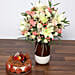 Beautiful White and Peach Flowers In Vase With Cake